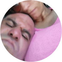 A man and woman sleeping in a circle.