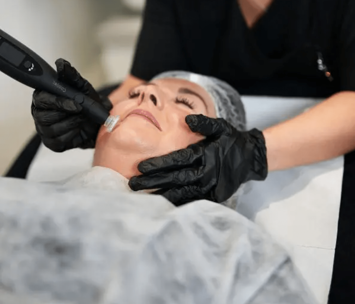 cooljet - Elmira Studio A woman getting a facial treatment at a beauty salon.