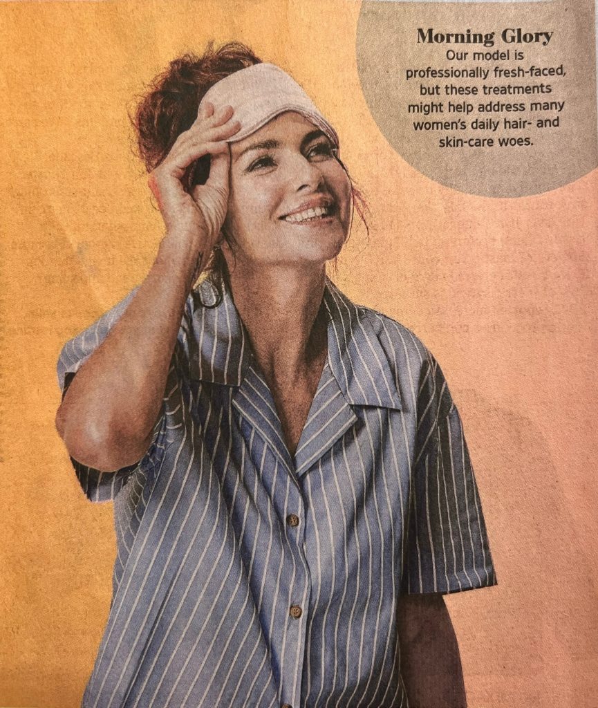 A newspaper article with a woman wearing a headband.